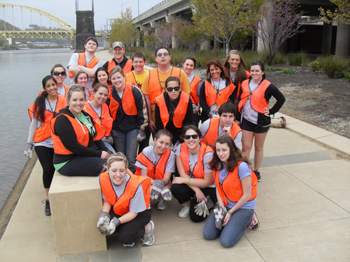 Point Park student volunteers pose along the Mon Wharf Landing