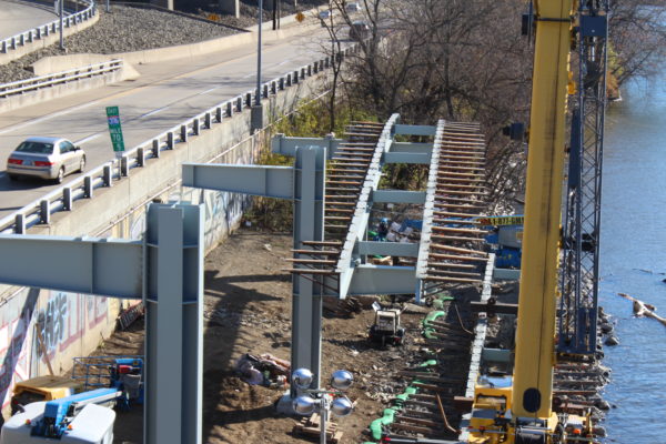 Close-up of the steel section being placed by the crane.