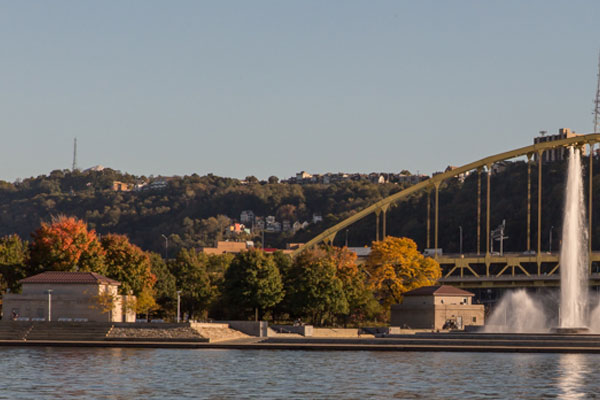 View of the Allegheny River side of Point State Park with two stone buildings
