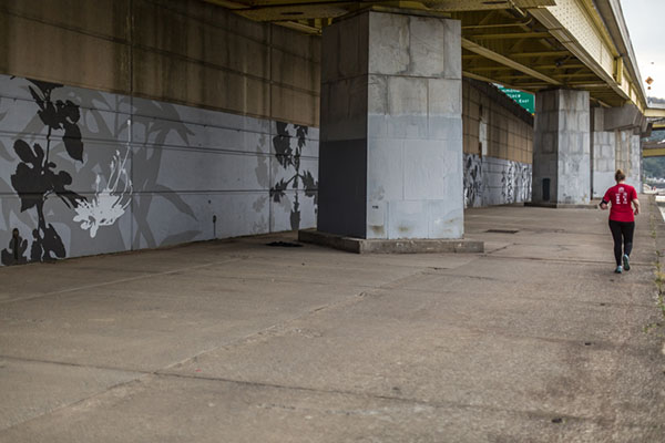 Beck’s work spans the 750-foot wall under the bridge on-ramp and was painted by dozens of volunteers over a six-week period.