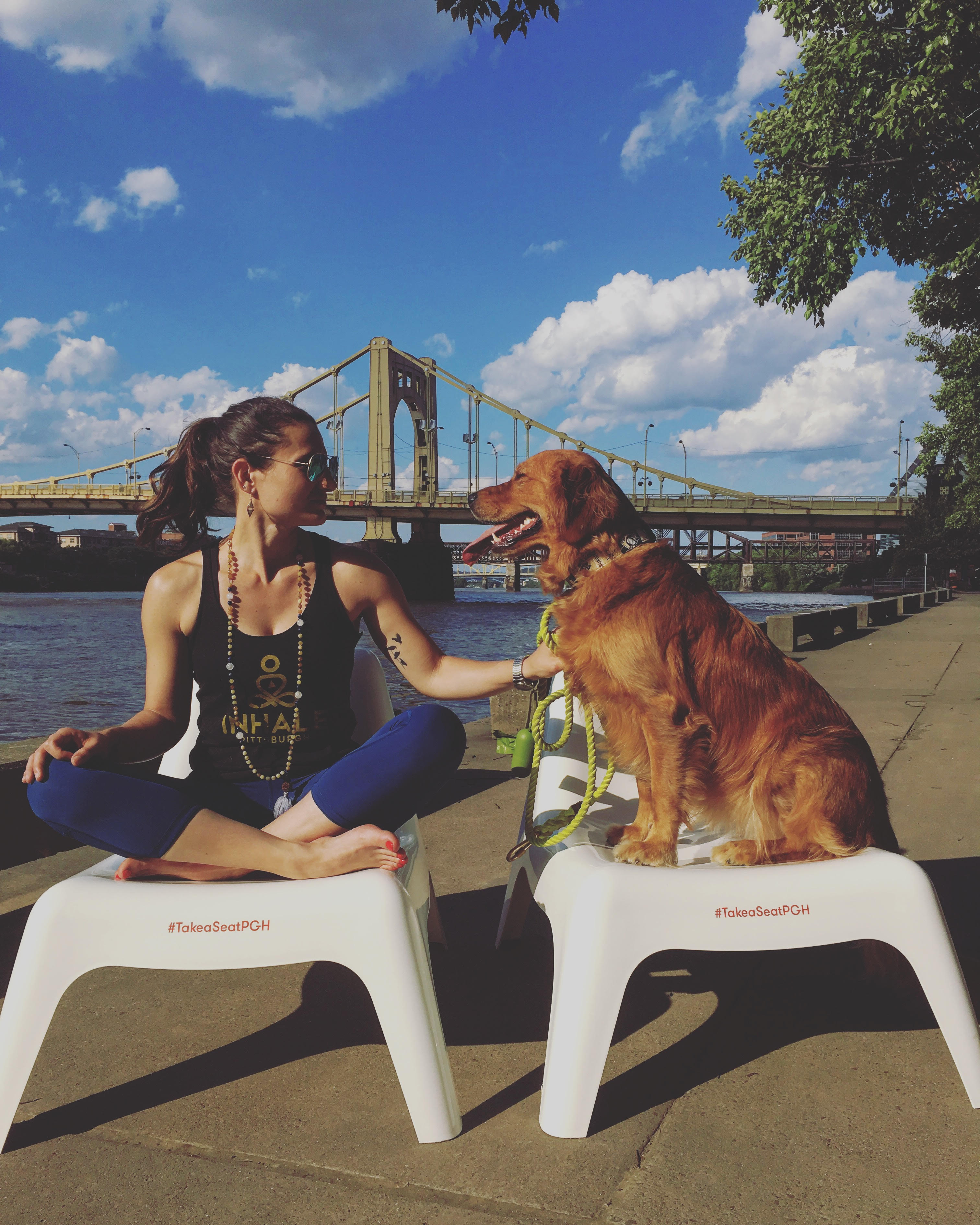 Take a Seat yoga teacher with dog