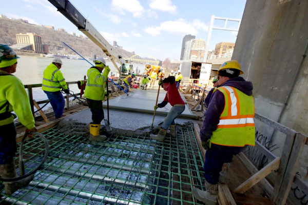 After a long winter, construction resumes and the first section of concrete for the ramp is poured. Additional concrete work will proceed dependent on the weather. Photo: Carol Galand